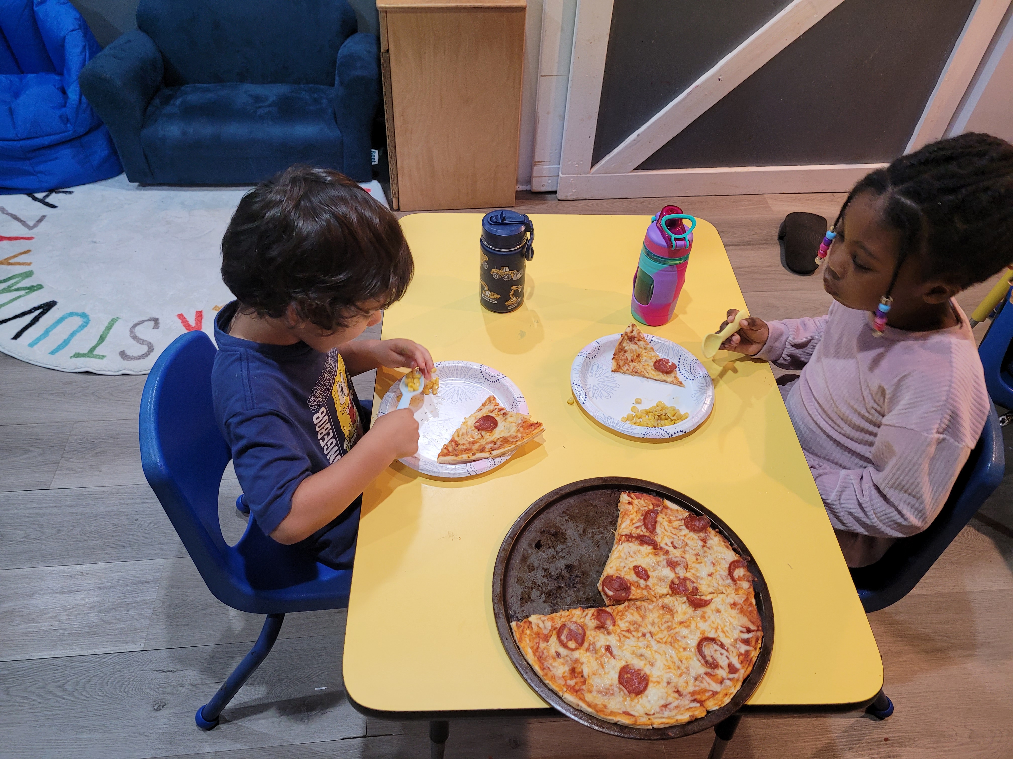 Children learning and playing in a bright Megaminds classroom